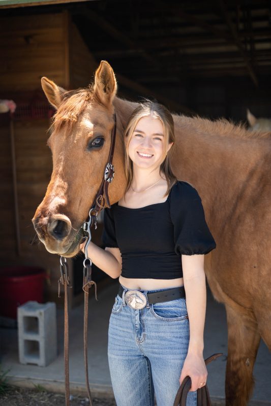 Photo of Tessa Wannenburgh with a horse. 
