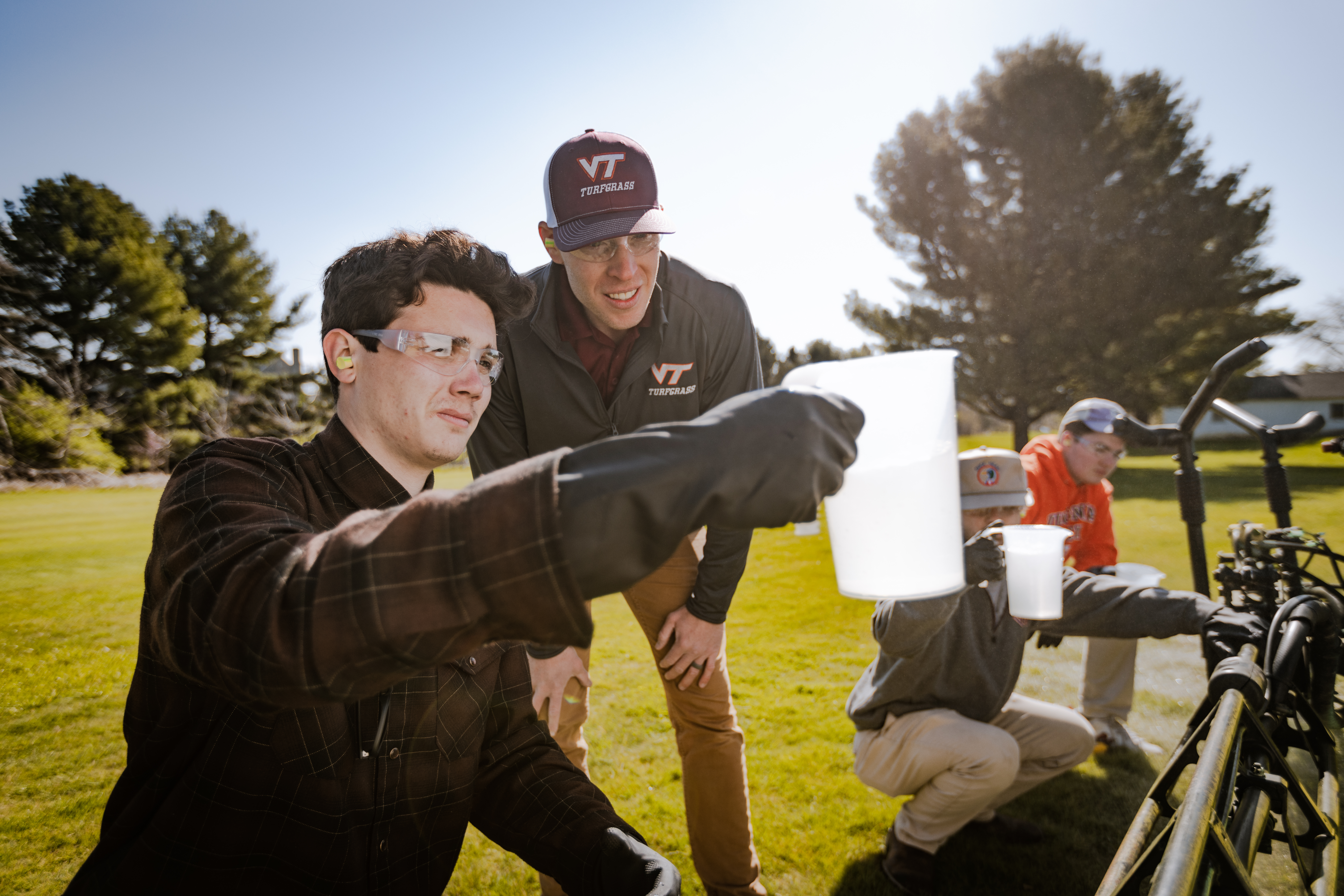Jonathan with students in field